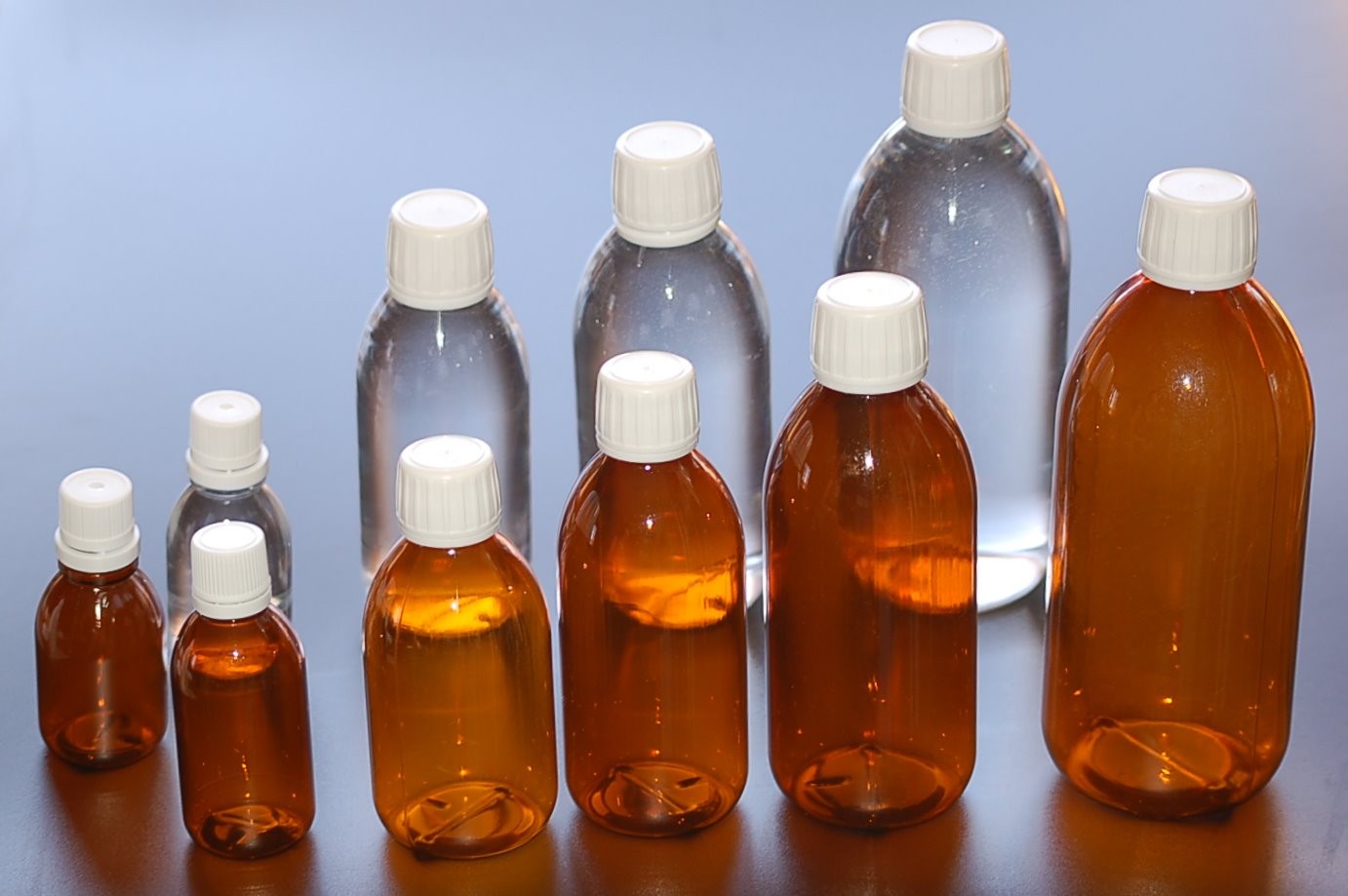 Flacons pharmaceutiques plastique ambrés et transparents avec bouchons inviolables, gamme ELIXIR